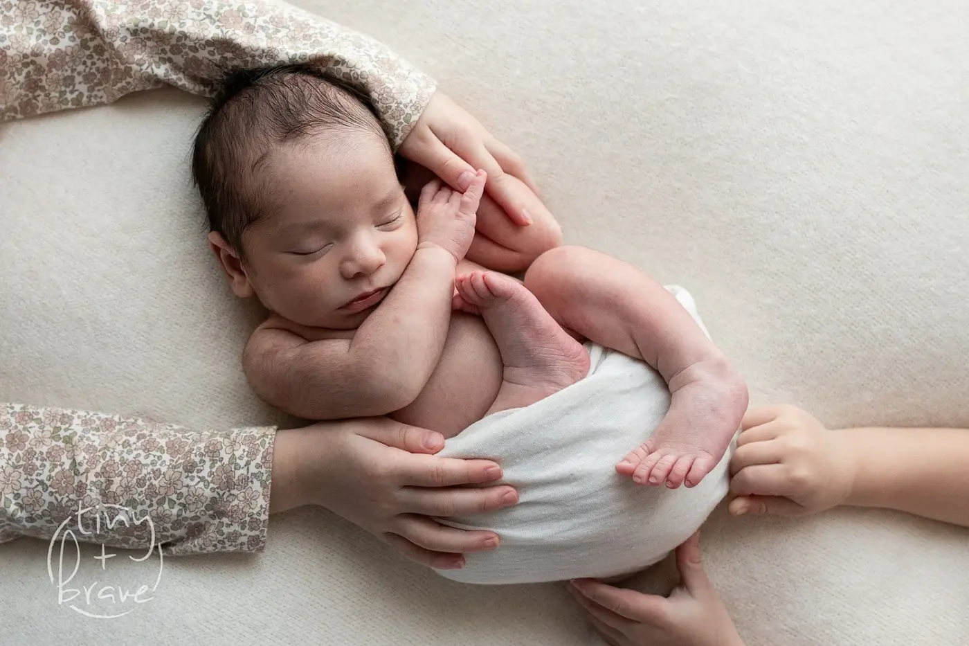 A sleeping newborn in the Tiny and Brave studio